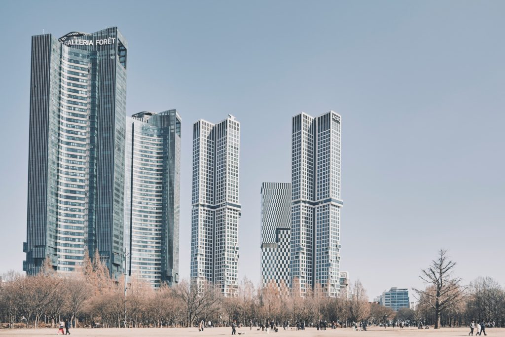 Modern mid-rise apartment buildings with colorful facades in a Korean residential neighborhood