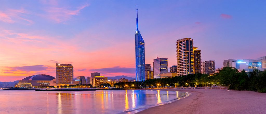 Fukuoka skyline at sunset, one of the best cities where to live in Japan for foreigners thanks to its affordable cost of living and high quality of life.